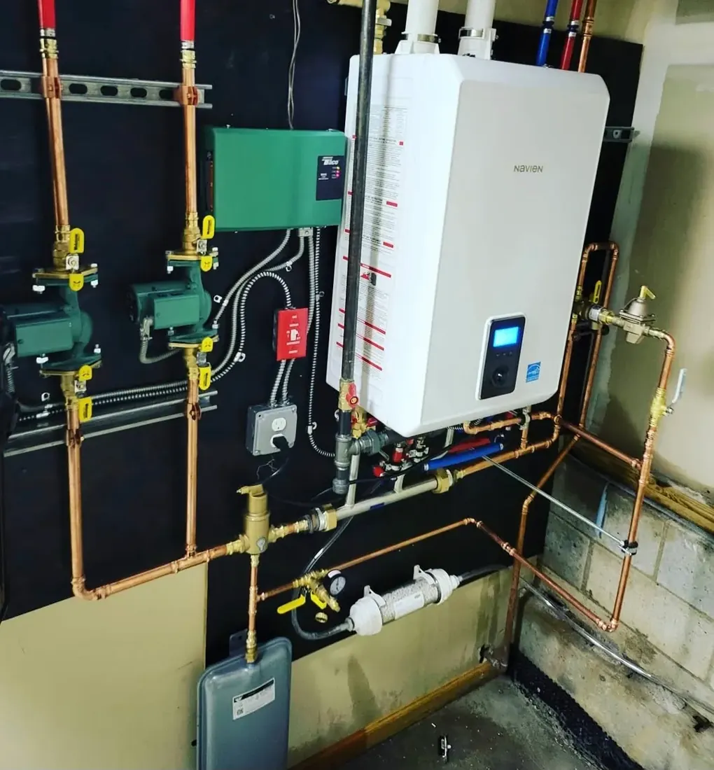 Wall-hung combi boiler and copper near-boiler piping installed in a Clifton, NJ basement